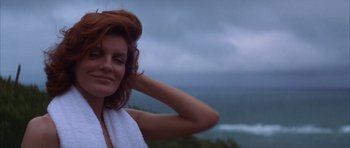 Movie still from “The Thomas Crown Affair” (1999), directed by John McTiernan – A woman with a towel around her neck; Close Up shot, Low angle
