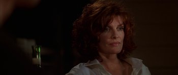 Movie still from “The Thomas Crown Affair” (1999), directed by John McTiernan – A person wearing a white shirt; Close Up shot, Low angle