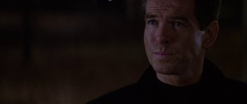 Movie still from “The Thomas Crown Affair” (1999), directed by John McTiernan – A person wearing a black shirt; Close Up shot, Over the shoulder angle