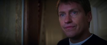 Movie still from “The Thomas Crown Affair” (1999), directed by John McTiernan – A person with blue eyes; Close Up shot, Low angle