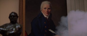 Movie still from “The Thomas Crown Affair” (1999), directed by John McTiernan – A painting of a man smoking a cigarette; Close Up shot, Low angle