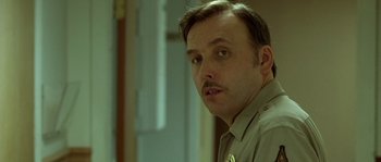 Movie still from “The Three Burials of Melquiades Estrada” (2005), directed by Tommy Lee Jones – A person with a mustache; Close Up shot, Low angle