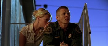 Movie still from “The Three Burials of Melquiades Estrada” (2005), directed by Tommy Lee Jones – A man and a woman sitting next to each other; Close Up shot, Low angle