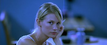 Movie still from “The Three Burials of Melquiades Estrada” (2005), directed by Tommy Lee Jones – A beautiful blond woman with a cigarette in her mouth; Close Up shot, Low angle