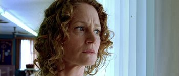 Movie still from “The Three Burials of Melquiades Estrada” (2005), directed by Tommy Lee Jones – A person with curly red hair; Close Up shot, Low angle