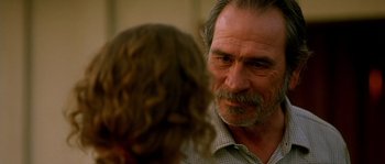Movie still from “The Three Burials of Melquiades Estrada” (2005), directed by Tommy Lee Jones – An older man and a young woman are talking to each other; Close Up shot, Over the shoulder angle