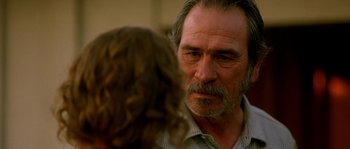 Movie still from “The Three Burials of Melquiades Estrada” (2005), directed by Tommy Lee Jones – An older man and a young woman talking to each other; Close Up shot, Over the shoulder angle