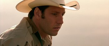 Movie still from “The Three Burials of Melquiades Estrada” (2005), directed by Tommy Lee Jones – A person wearing a cowboy hat; Close Up shot, Low angle