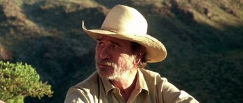 Movie still from “The Three Burials of Melquiades Estrada” (2005), directed by Tommy Lee Jones – A person wearing a hat; Close Up shot, Over the shoulder angle