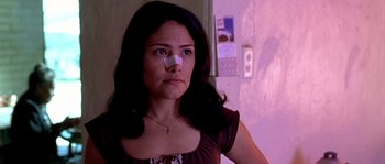 Movie still from “The Three Burials of Melquiades Estrada” (2005), directed by Tommy Lee Jones – A woman with a bandage on her nose; Close Up shot, Low angle