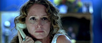 Movie still from “The Three Burials of Melquiades Estrada” (2005), directed by Tommy Lee Jones – A person with curly hair; Close Up shot, Low angle