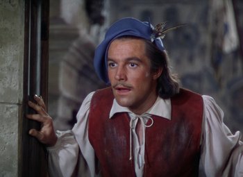 Movie still from “The Three Musketeers” (1948), directed by George Sidney – A person wearing a hat with a bird on it; Close Up shot, High angle