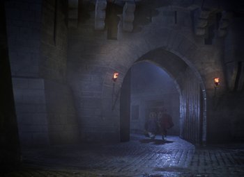 Movie still from “The Three Musketeers” (1948), directed by George Sidney – Two people walking in a dark alley with a light on; Extreme Wide shot, High angle