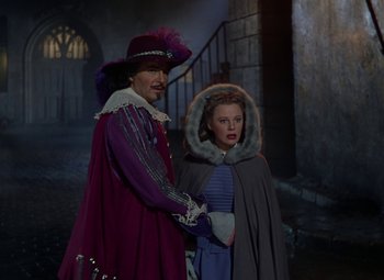 Movie still from “The Three Musketeers” (1948), directed by George Sidney – A man and a woman dressed in costumes; Medium shot, Over the shoulder angle
