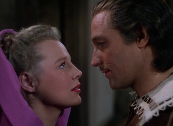 Movie still from “The Three Musketeers” (1948), directed by George Sidney – A man and a woman face to face in front of each other; Close Up shot, Low angle