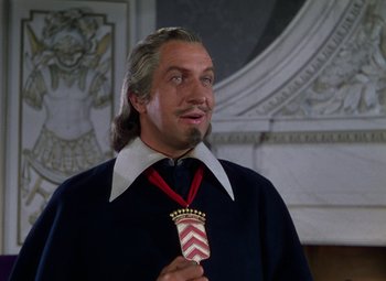Movie still from “The Three Musketeers” (1948), directed by George Sidney – A man with long white hair and a beard is holding an award; Close Up shot, Low angle