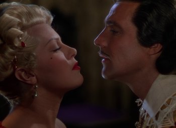 Movie still from “The Three Musketeers” (1948), directed by George Sidney – A man and a woman face to face in front of each other; Close Up shot, Low angle