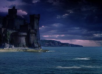 Movie still from “The Three Musketeers” (1948), directed by George Sidney – A castle on a cliff in the middle of the ocean; Extreme Wide shot, High angle