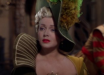 Movie still from “The Three Musketeers” (1948), directed by George Sidney – A person wearing a hat; Close Up shot, Over the shoulder angle