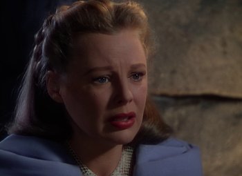 Movie still from “The Three Musketeers” (1948), directed by George Sidney – A woman with a concerned look on her face; Close Up shot, Over the shoulder angle