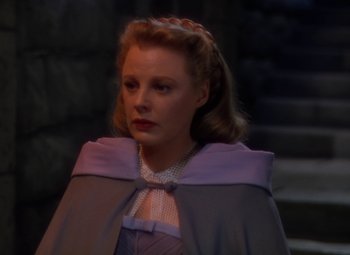 Movie still from “The Three Musketeers” (1948), directed by George Sidney – A woman wearing a purple dress and a purple cape; Close Up shot, High angle