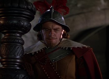 Movie still from “The Three Musketeers” (1948), directed by George Sidney – A person wearing a helmet; Close Up shot, Low angle
