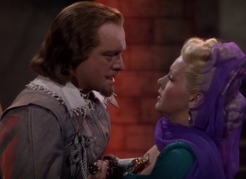 Movie still from “The Three Musketeers” (1948), directed by George Sidney – A man and a woman in medieval garb looking at one another; Medium shot, Over the shoulder angle