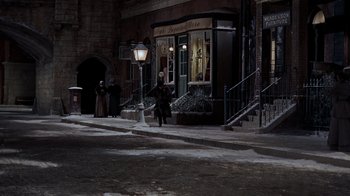 Movie still from “The Time Machine” (1960), directed by George Pal – A group of people walking down a street; Extreme Wide shot, High angle