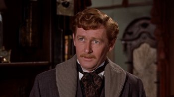 Movie still from “The Time Machine” (1960), directed by George Pal – A person wearing a suit and tie; Close Up shot, High angle