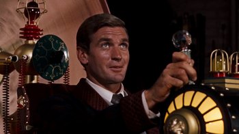 Movie still from “The Time Machine” (1960), directed by George Pal – A person wearing a suit and tie; Medium shot, Low angle