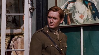 Movie still from “The Time Machine” (1960), directed by George Pal – A man in a military uniform standing in front of a painting; Close Up shot, Low angle
