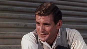Movie still from “The Time Machine” (1960), directed by George Pal – A person wearing a white shirt; Close Up shot, Over the shoulder angle