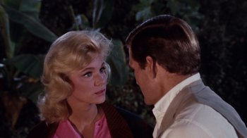 Movie still from “The Time Machine” (1960), directed by George Pal – A man and a woman talking to each other; Close Up shot, Over the shoulder angle
