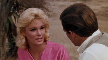 Movie still from “The Time Machine” (1960), directed by George Pal – A man and a woman talking to each other; Close Up shot, Over the shoulder angle