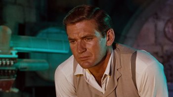 Movie still from “The Time Machine” (1960), directed by George Pal – A person wearing a suit and tie; Close Up shot, Over the shoulder angle