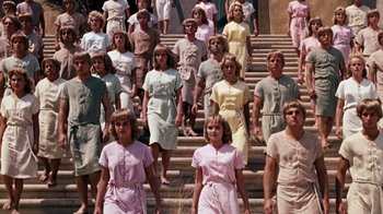 Movie still from “The Time Machine” (1960), directed by George Pal – A group of people standing on some steps; Wide shot, High angle