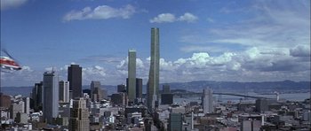 Movie still from “The Towering Inferno” (1974), directed by John Guillermin – A view of a large city with skyscrapers in the background; Extreme Wide shot, High angle