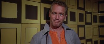 Movie still from “The Towering Inferno” (1974), directed by John Guillermin – A person wearing a jacket; Close Up shot, Low angle