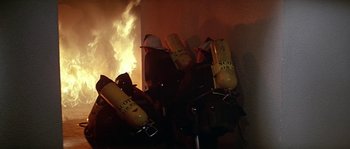 Movie still from “The Towering Inferno” (1974), directed by John Guillermin – A group of fire hydrants that are in a room; Medium shot, Low angle