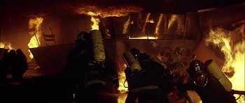 Movie still from “The Towering Inferno” (1974), directed by John Guillermin – A lot of fire in a room; Wide shot, Low angle