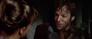 Movie still from “The Towering Inferno” (1974), directed by John Guillermin – A man and a woman are looking at each other; Close Up shot, Over the shoulder angle