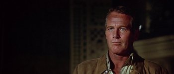 Movie still from “The Towering Inferno” (1974), directed by John Guillermin – A person wearing a jacket; Close Up shot, Low angle