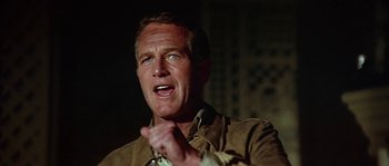 Movie still from “The Towering Inferno” (1974), directed by John Guillermin – A person wearing a jacket; Close Up shot, Low angle