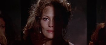 Movie still from “The Towering Inferno” (1974), directed by John Guillermin – A person wearing a dress; Close Up shot, Over the shoulder angle