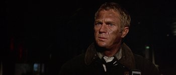 Movie still from “The Towering Inferno” (1974), directed by John Guillermin – A person wearing a jacket; Close Up shot, Low angle