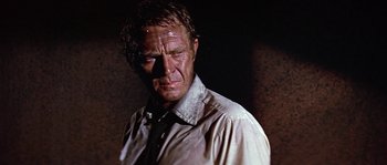 Movie still from “The Towering Inferno” (1974), directed by John Guillermin – A person wearing a shirt and a tie; Close Up shot, Low angle
