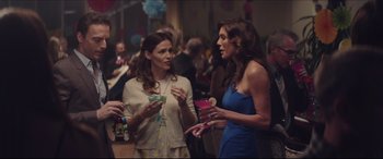 Movie still from “The Tribes of Palos Verdes” (2017), directed by Brendan Malloy – Two women are talking to each other at a party; Medium shot, Over the shoulder angle