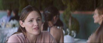 Movie still from “The Tribes of Palos Verdes” (2017), directed by Brendan Malloy – A person sitting on a chair; Close Up shot, Over the shoulder angle