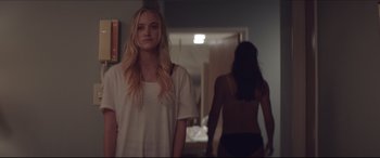 Movie still from “The Tribes of Palos Verdes” (2017), directed by Brendan Malloy – A woman standing next to another woman in a room; Medium shot, Over the shoulder angle