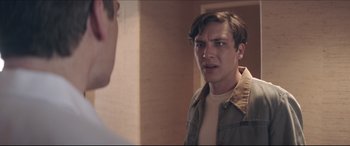 Movie still from “The Tribes of Palos Verdes” (2017), directed by Brendan Malloy – A young man looking into a mirror in a room; Close Up shot, Over the shoulder angle